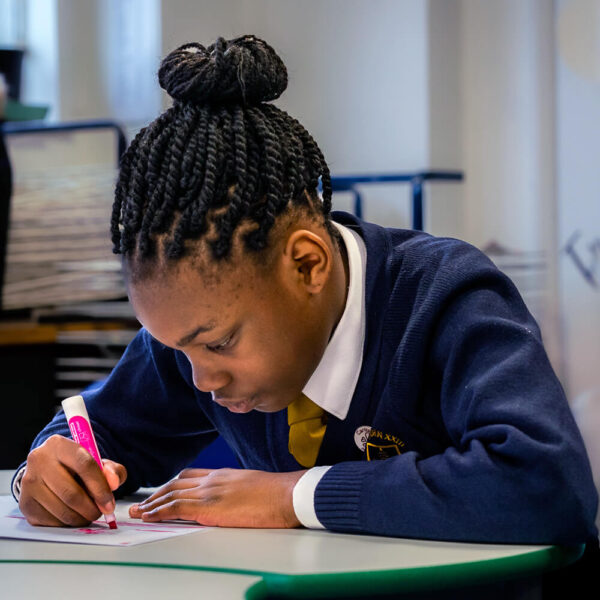 A pupil working in a classroom